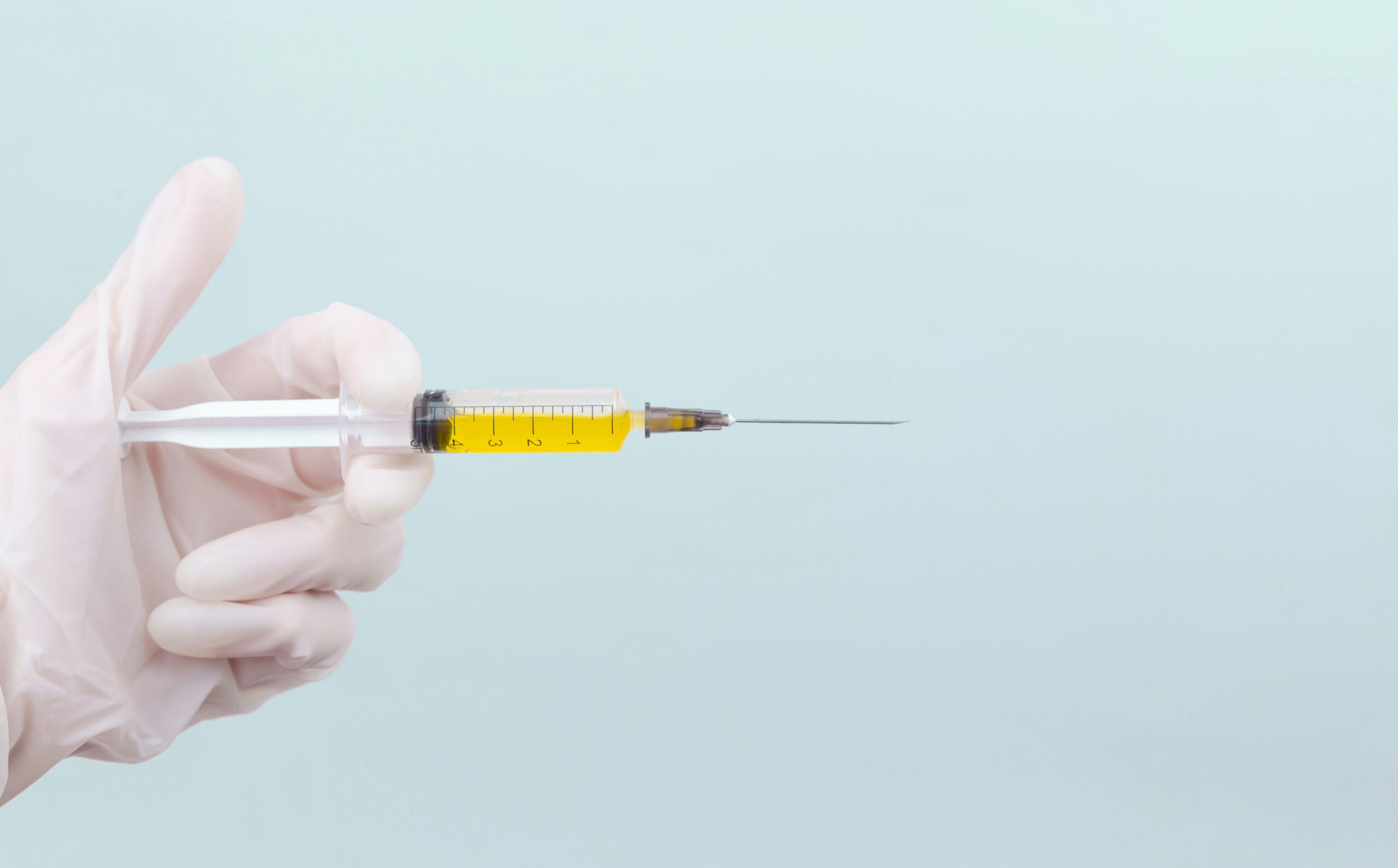 Medical professional preparing an injection